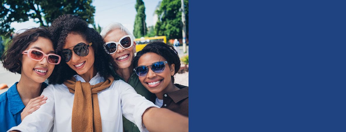 A promotional image showing four women wearing sunglasses