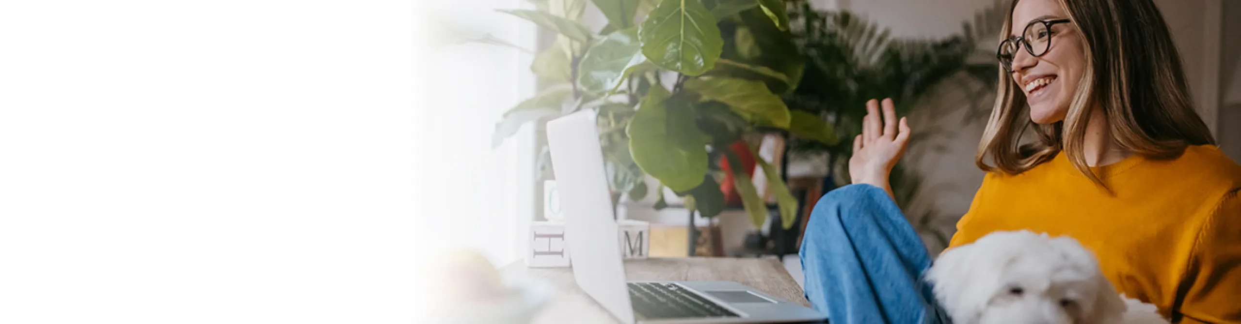 Woman on video chat with dog in her lap