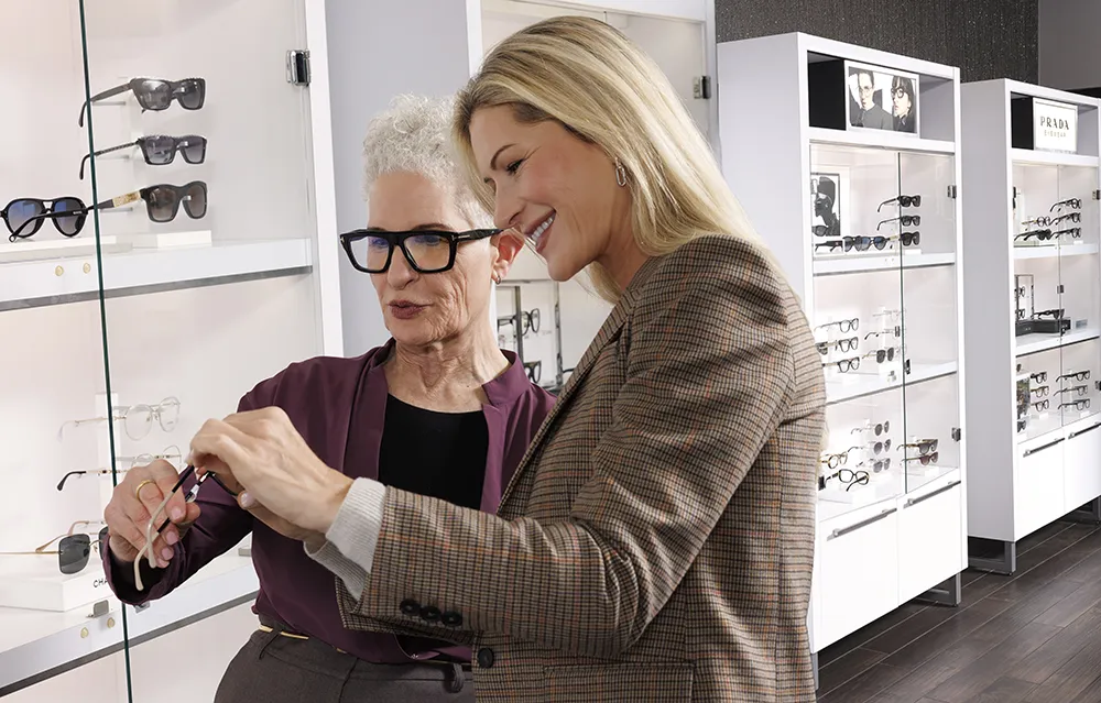 Females browsing glasses at eye doctor