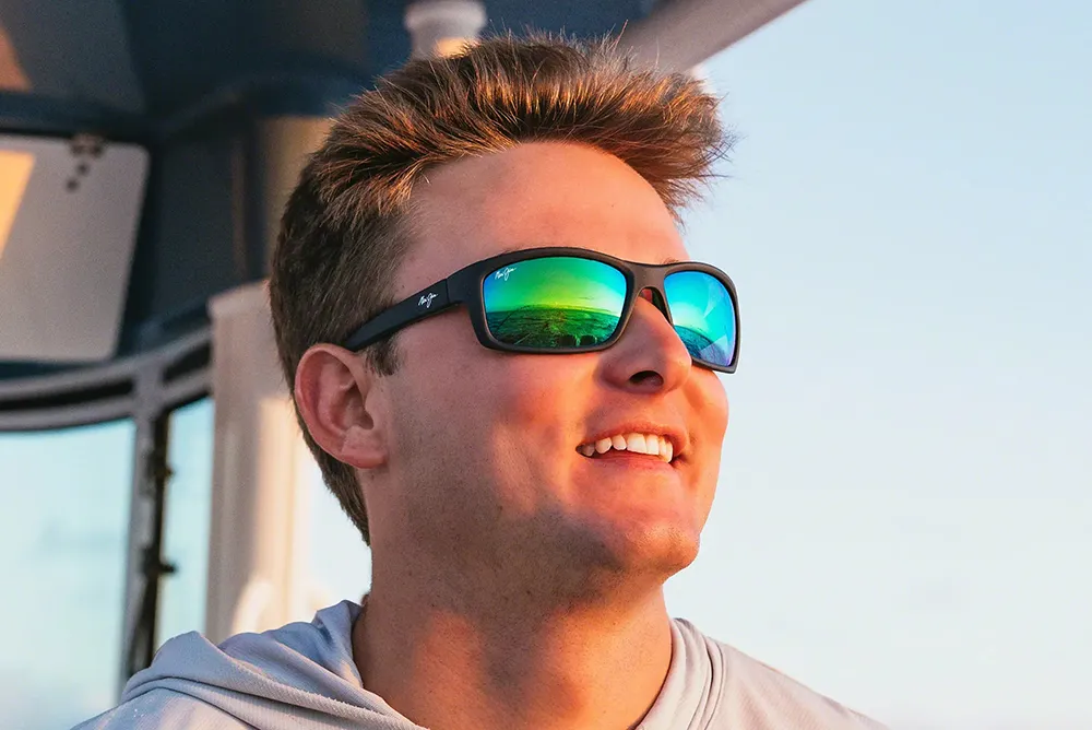 Male wearing sunglasses on boat