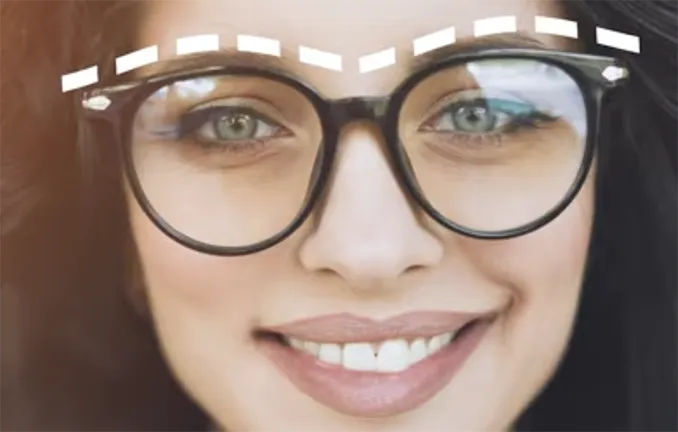 Female wearing black frame round glasses
