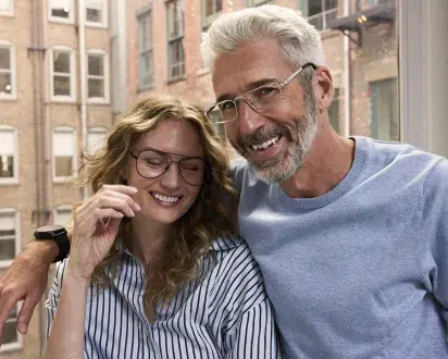 Male and female wearing glasses side by side