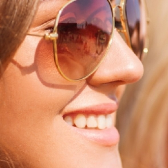 Women wearing sunglasses smiling