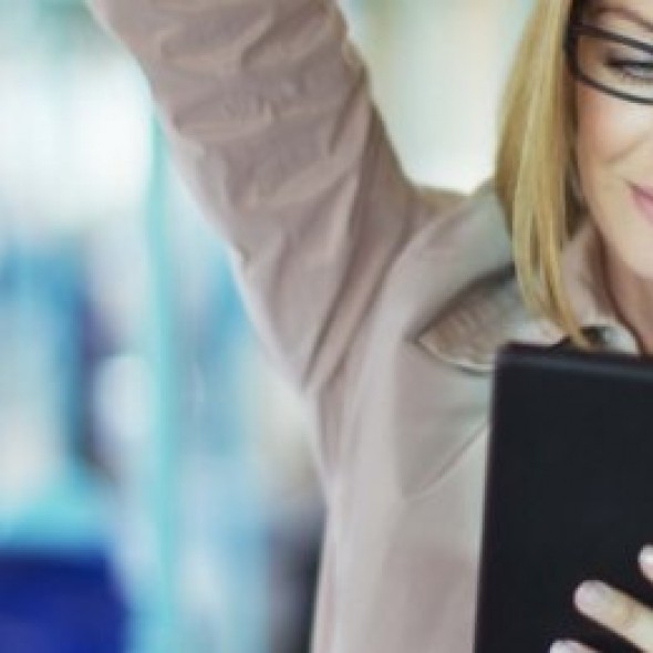 women in glasses reading tablet on bus 