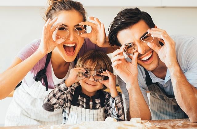 Family members smiling into camera