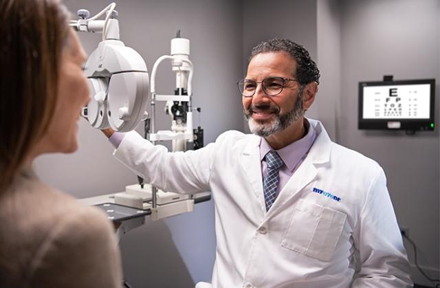 Eye doctor giving warm expression to patient 