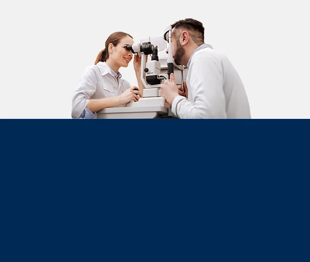 optician performing an eye exam to a patient