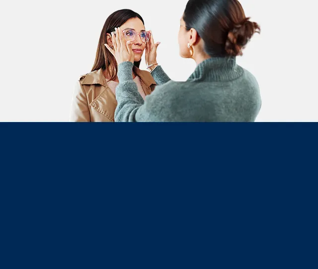 Optician putting glasses on a customer-Mobile version