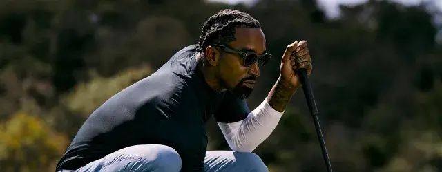 Male playing golf wearing Oakley Performance AI Meta glasses.