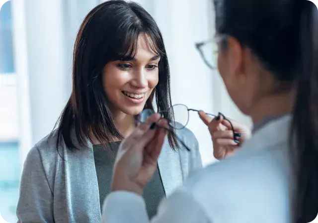 patient in-store with doctor_associate, reviewing frames