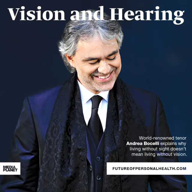 Andrea Bocelli smiling with head down
