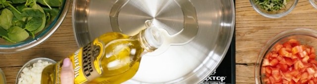 pouring olive oil in pan