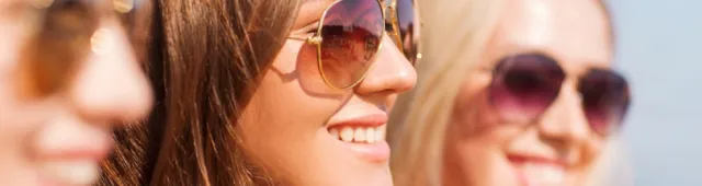 Women wearing sunglasses smiling