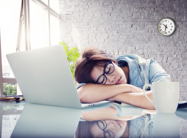 Woman asleep at desk