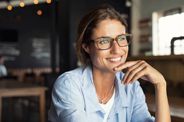 Image of woman smiling in glasses