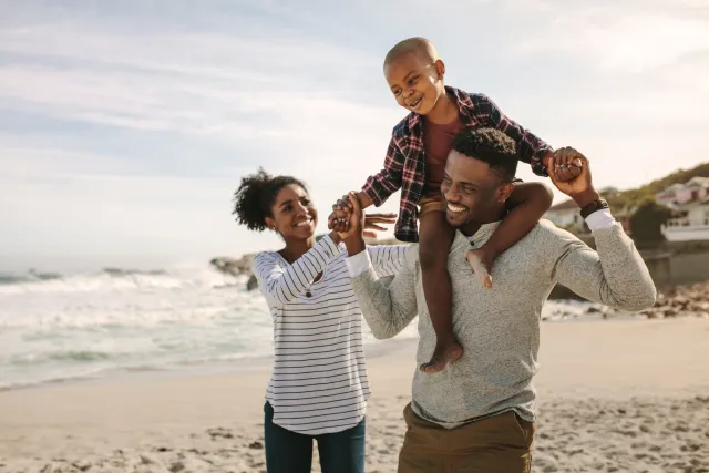 Family having fun on the beach