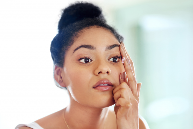 Woman putting in contact
