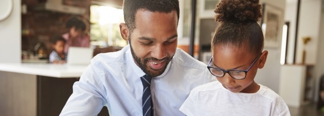 Father and daughter reading together