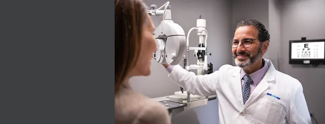 Eye doctor explaining test to patient