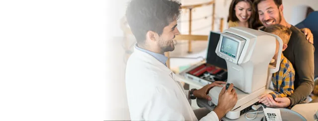 Eye doctor performing test on child