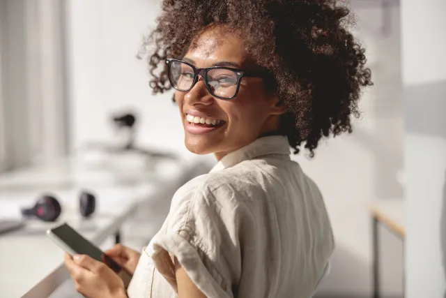 Woman with curly hair smiling